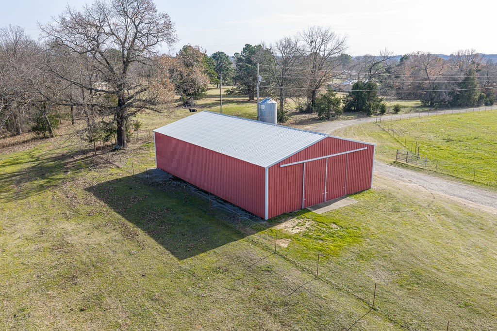 3022 Dow Jones Road Alma, AR 72921 - Photo 26 of 34 View of pole building featuring a yard and view of wooded area