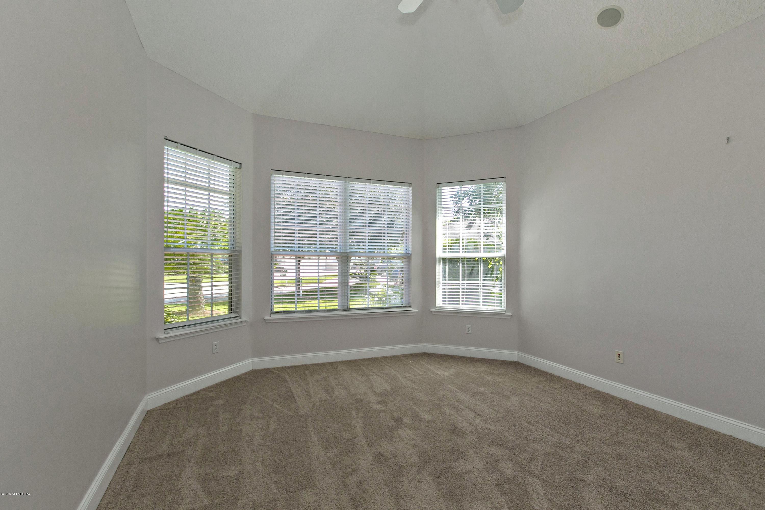2156 West Quay Road St. Augustine, FL 32092 - Photo 20 of 51 an empty room with a window