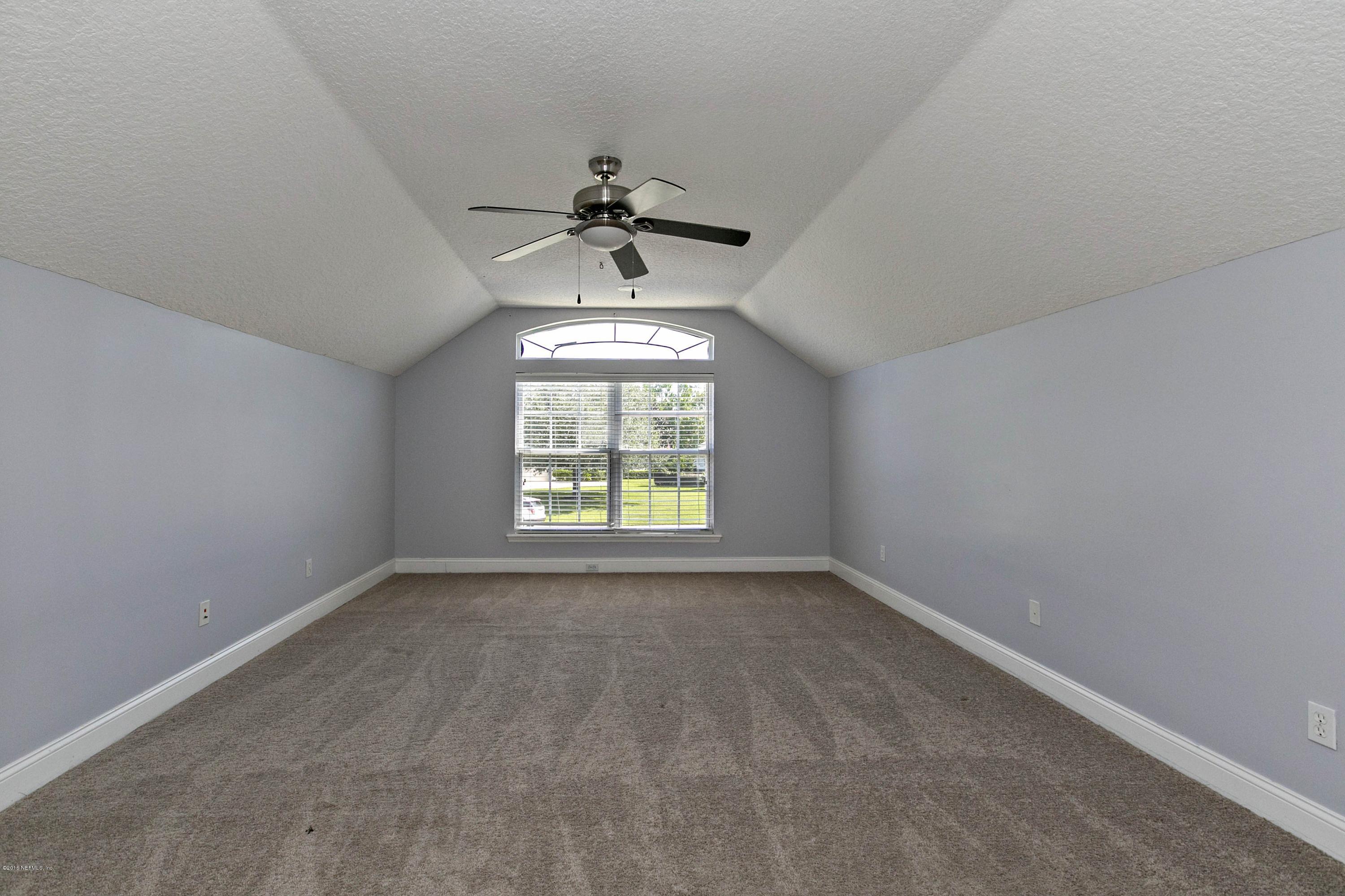 2156 West Quay Road St. Augustine, FL 32092 - Photo 22 of 51 a view of an empty room with a window