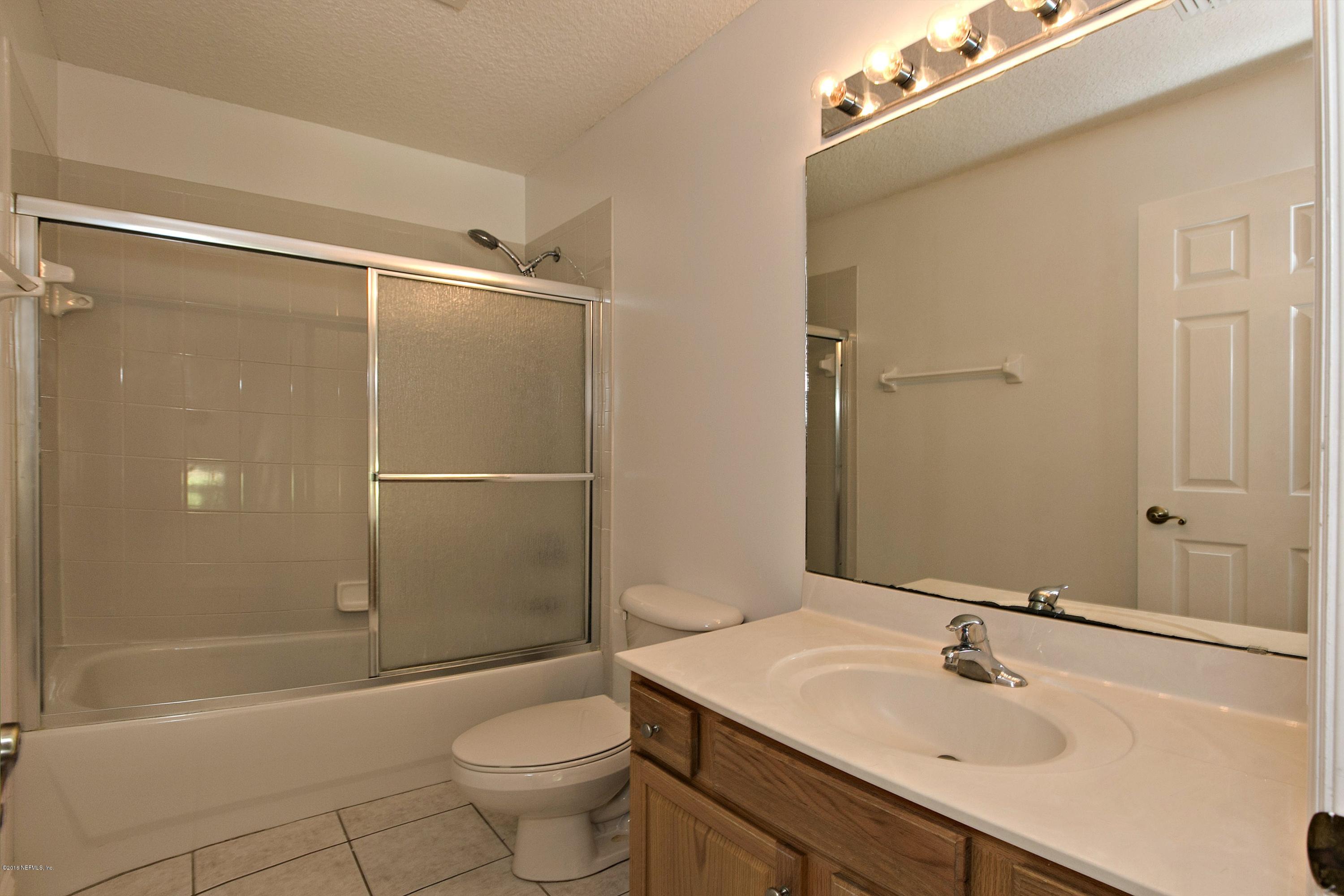 2156 West Quay Road St. Augustine, FL 32092 - Photo 23 of 51 a bathroom with a sink toilet and shower