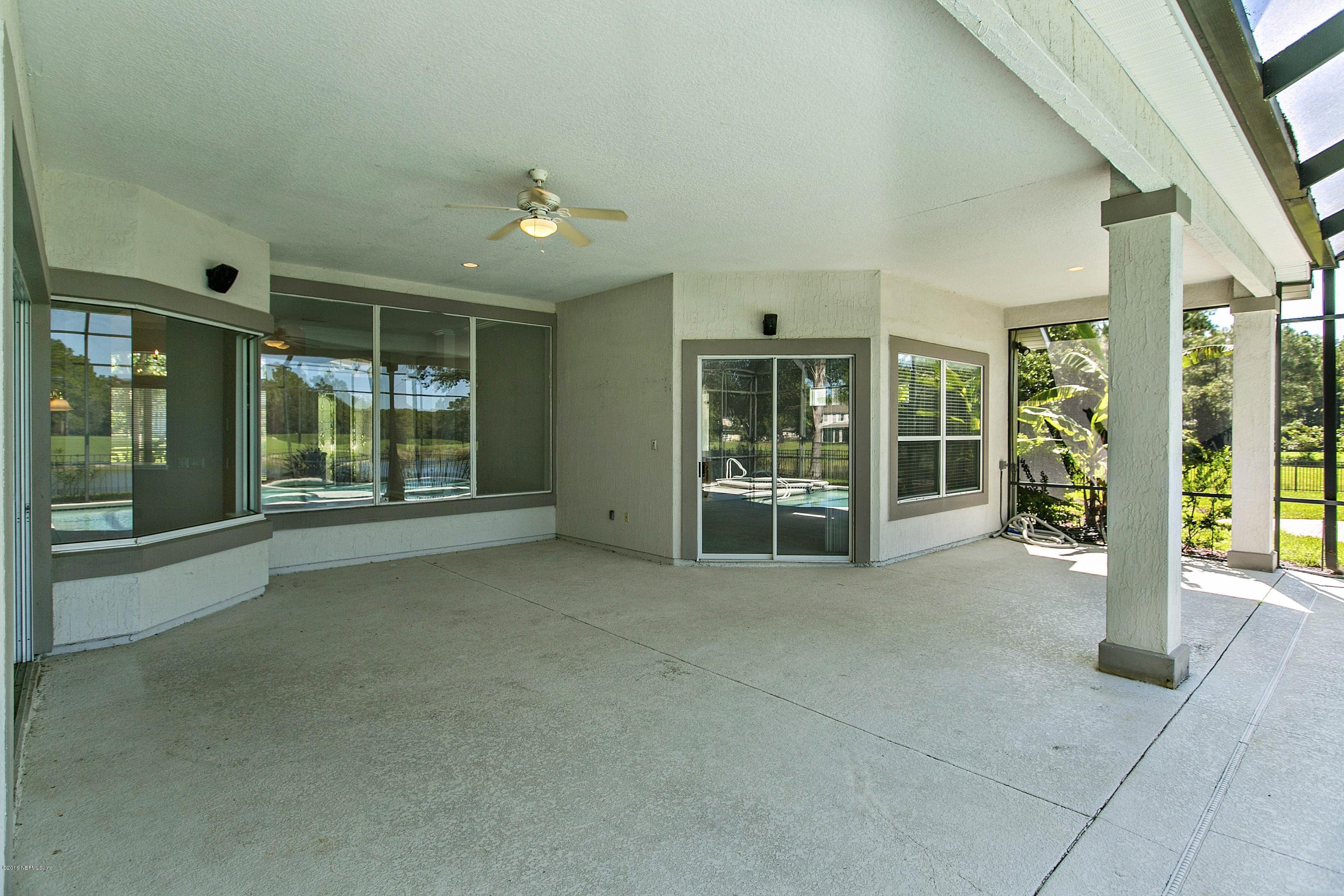 2156 West Quay Road St. Augustine, FL 32092 - Photo 28 of 51 a view of an empty room with floor to ceiling windows