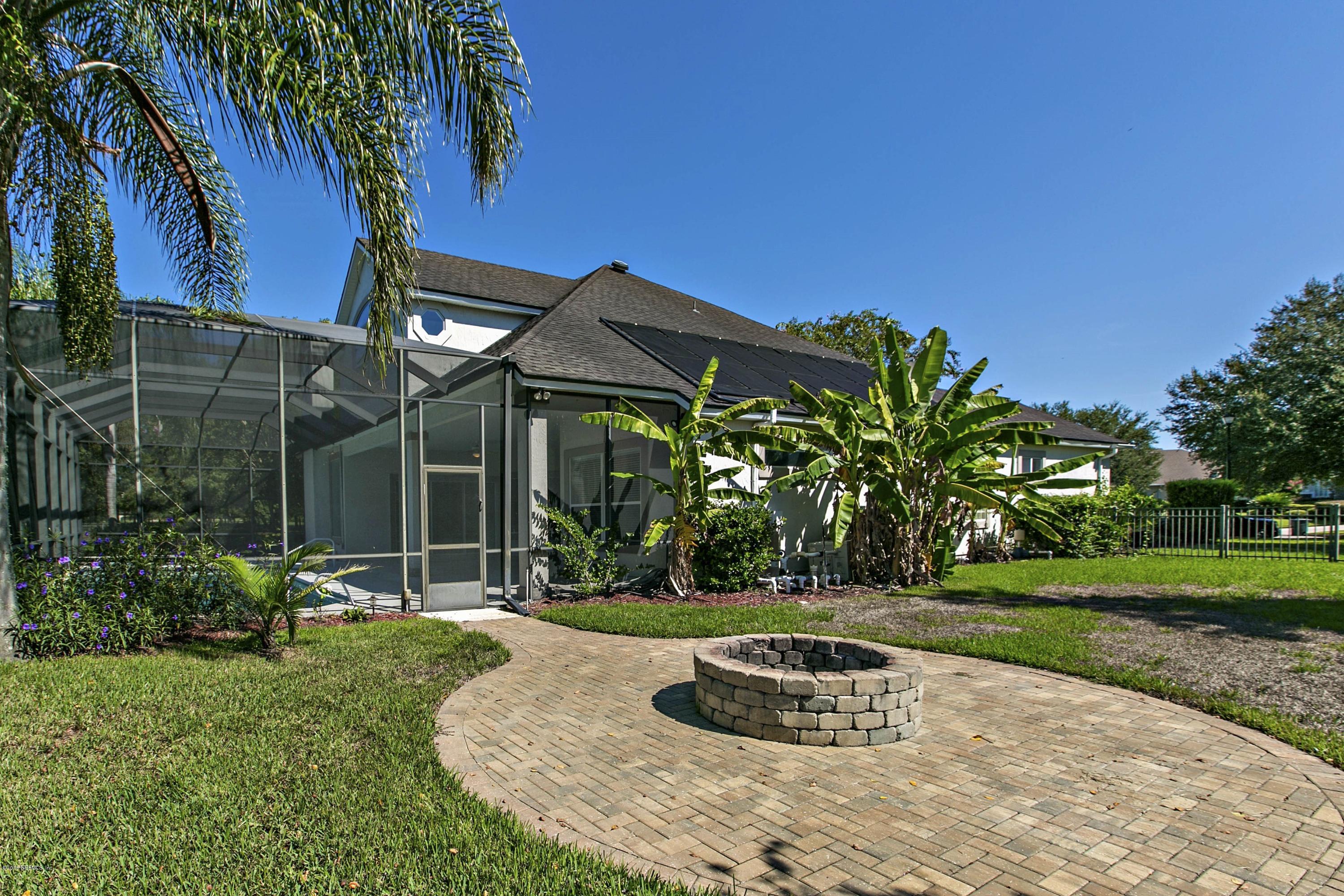 2156 West Quay Road St. Augustine, FL 32092 - Photo 30 of 51 a front view of a house with a yard