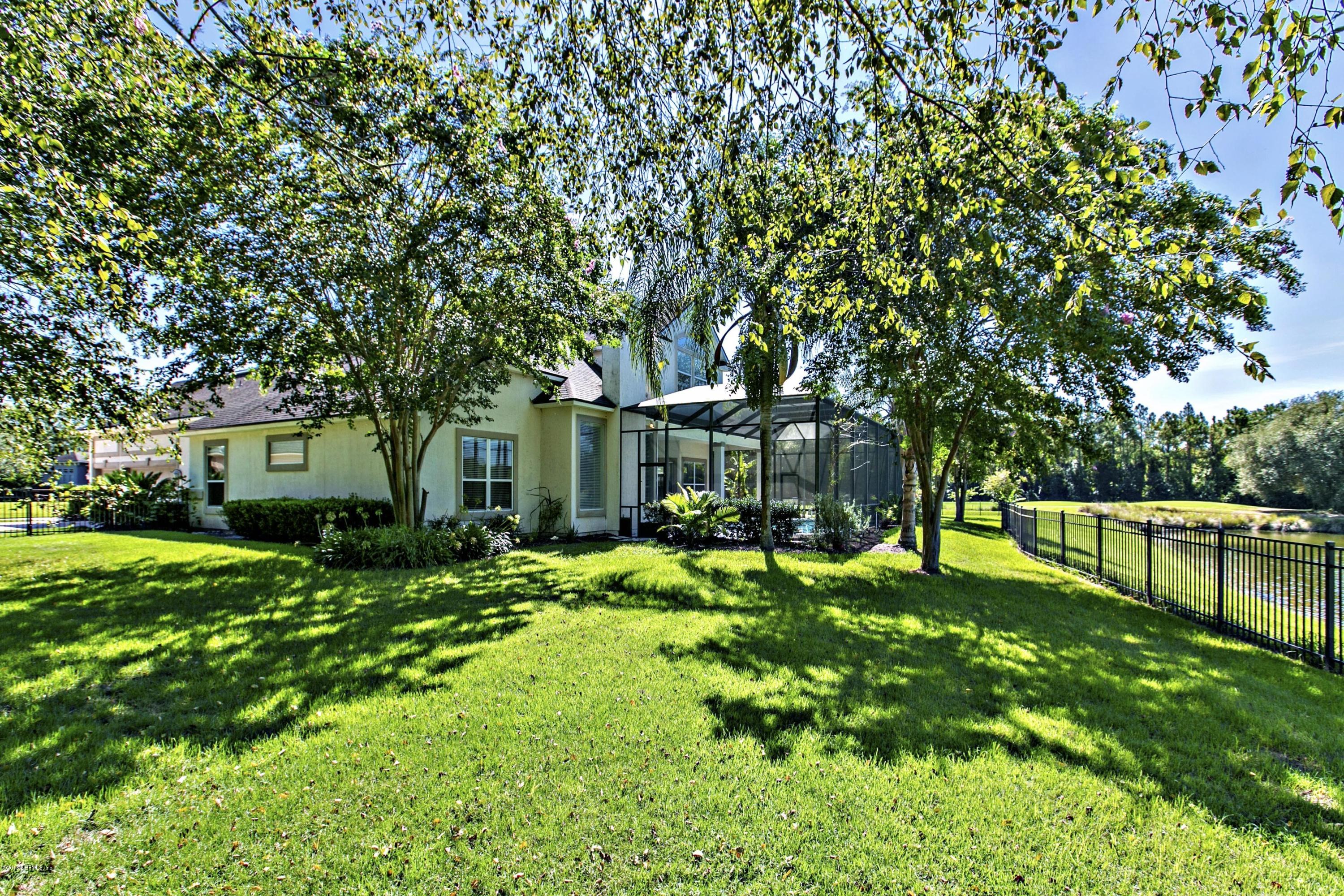 2156 West Quay Road St. Augustine, FL 32092 - Photo 33 of 51 a front view of a house with garden