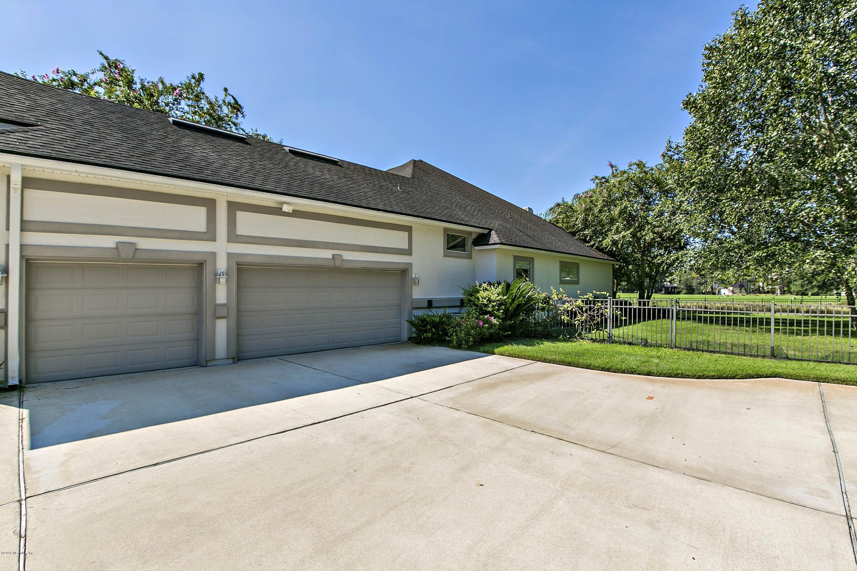2156 West Quay Road St. Augustine, FL 32092 - Photo 34 of 51 a view of backyard with a garden and entertaining space