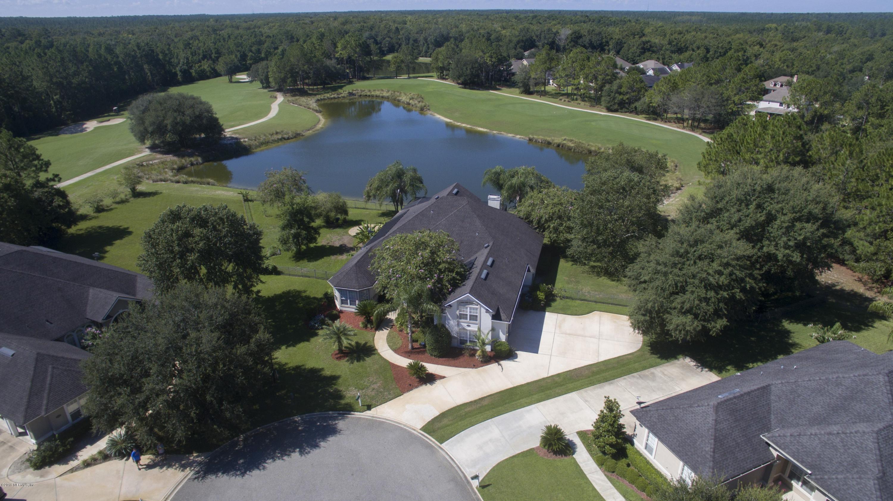 2156 West Quay Road St. Augustine, FL 32092 - Photo 36 of 51 an aerial view of a house with garden space and lake view