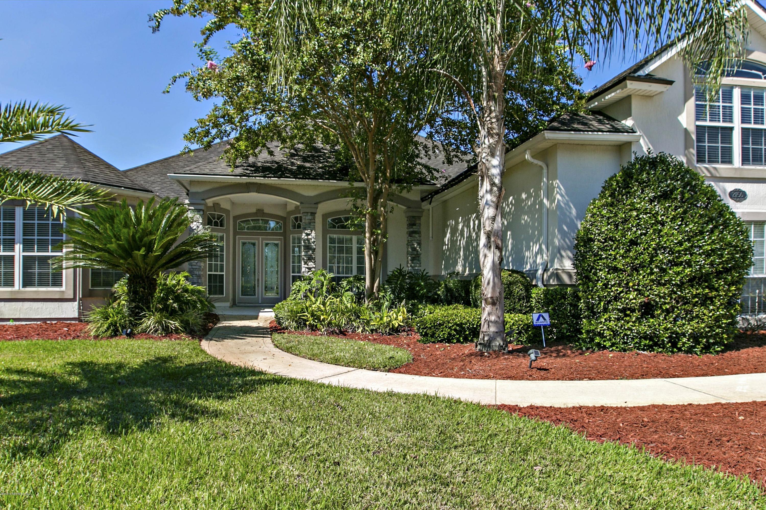 2156 West Quay Road St. Augustine, FL 32092 - Photo 4 of 51 a front view of a house with a yard
