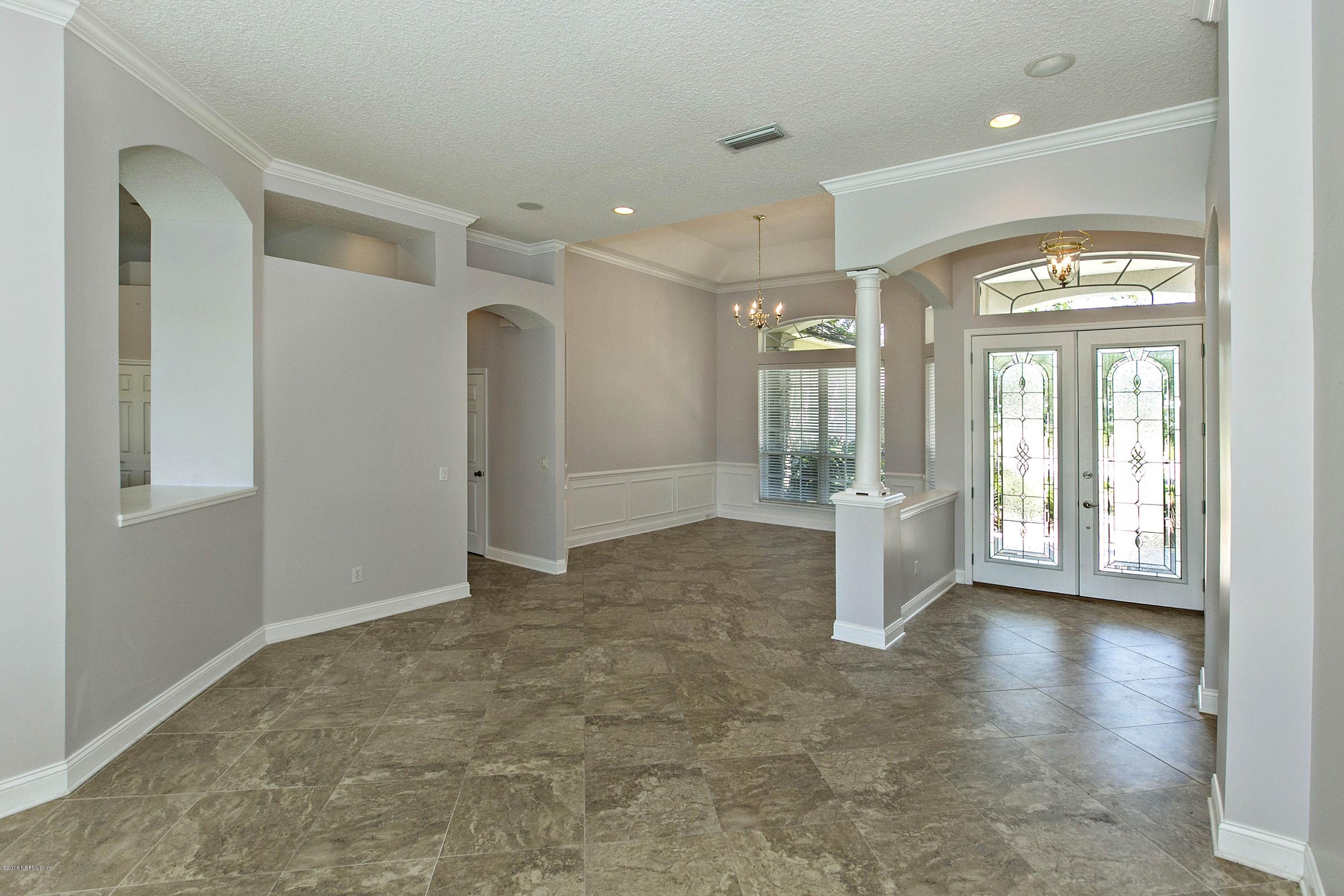 2156 West Quay Road St. Augustine, FL 32092 - Photo 8 of 51 wooden floor with a chandelier fan and windows