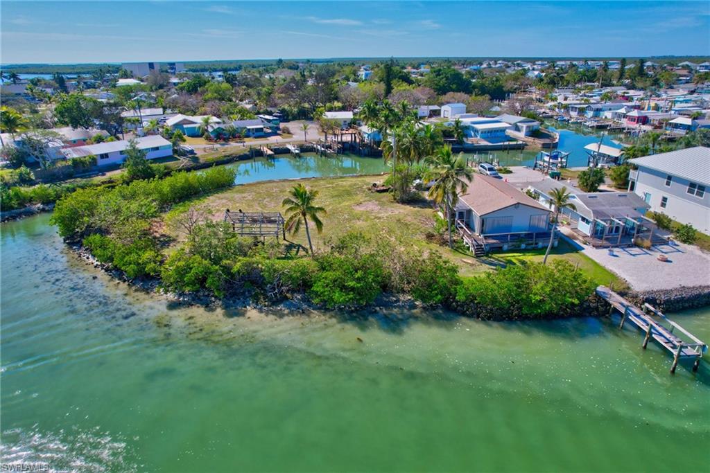 105 Bayshore Way Goodland, FL 34140 - Photo 3 of 7 Drone / aerial view with a water view