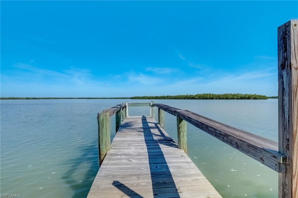 105 Bayshore Way Goodland, FL 34140 - Photo 7 of 7 View of dock with a water view