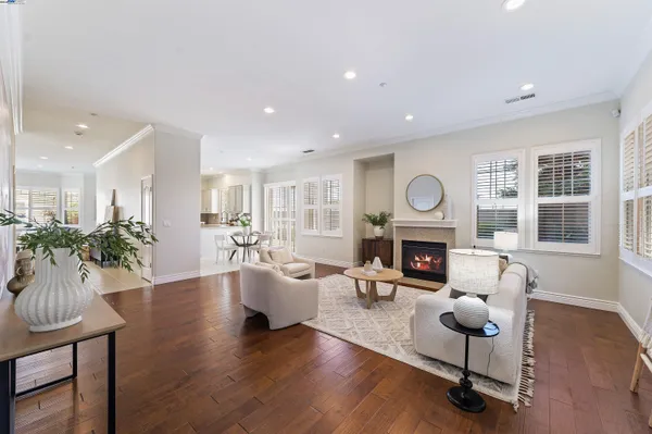 a living room with furniture fireplace and window
