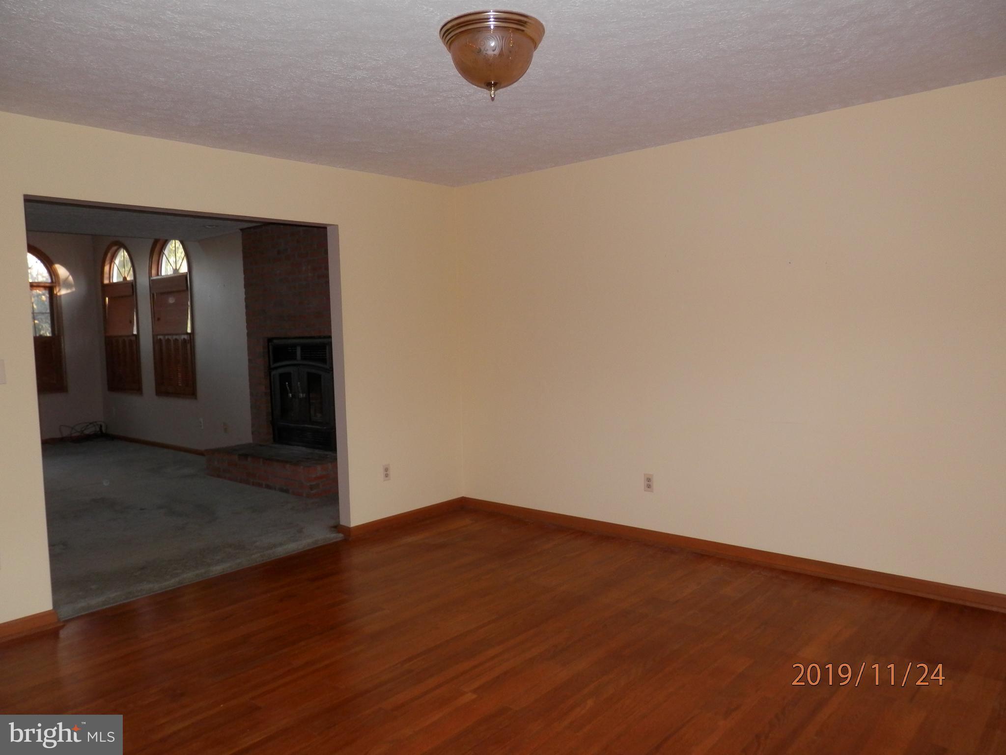 133 Long Point Road Stevensville, MD 21666 - Photo 6 of 36 Formal Living Room into Family Room