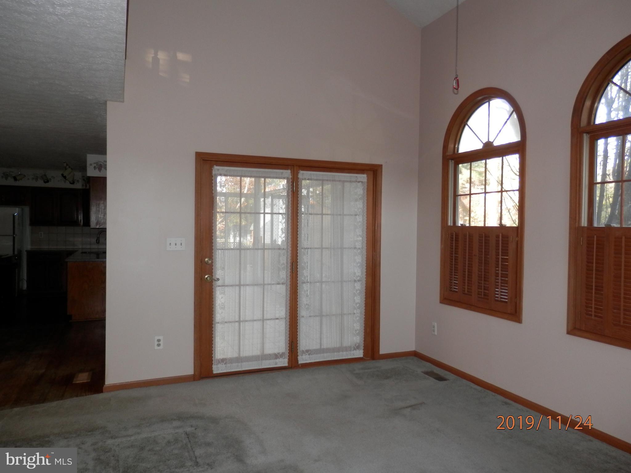 133 Long Point Road Stevensville, MD 21666 - Photo 7 of 36 Family Room doors to Sunroom