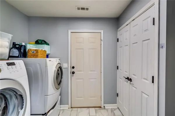 a utility room with dryer and washer