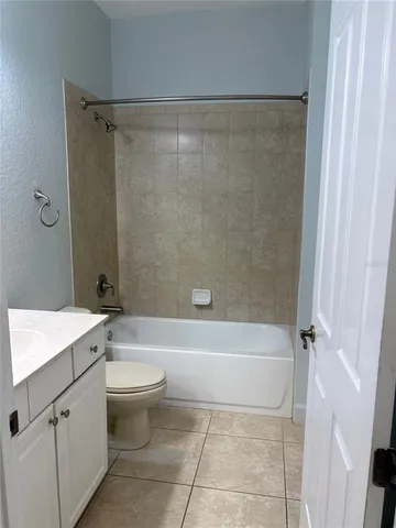 a bathroom with a sink a toilet and a bathtub