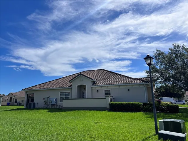 a view of a house with a yard