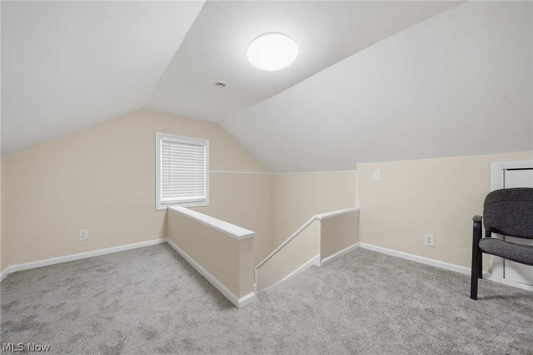 2231 Brockway Road University Heights, OH 44118 - Photo 27 of 46 Carpeted loft area featuring sloped ceilings, a single window with blinds, and white trim