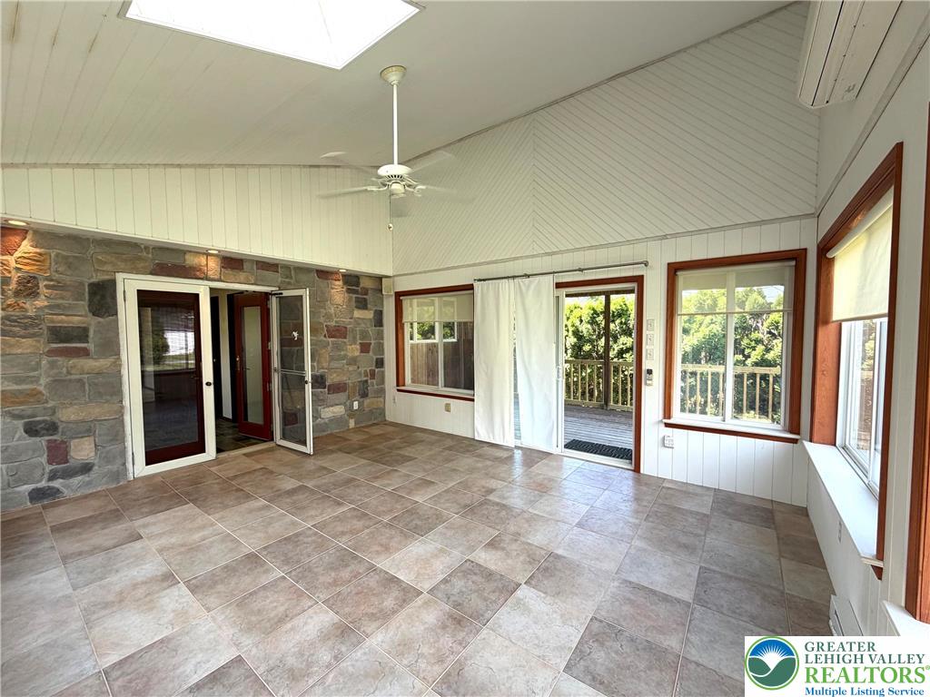 2741 Limestone Street Coplay, PA 18037 - Photo 21 of 35 Natural light floods this sun-filled room featuring durable tile flooring and skylights.