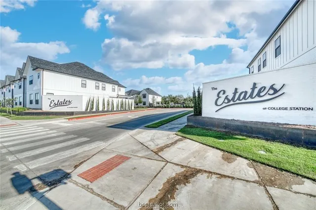 a street sign on a street next to a building