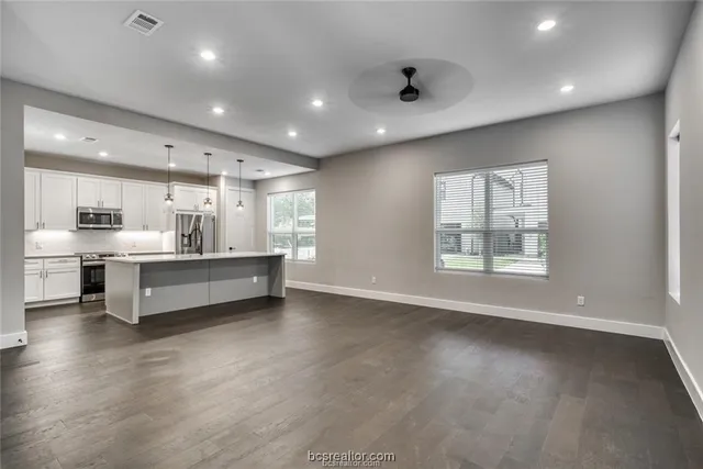 a large living room with a large window