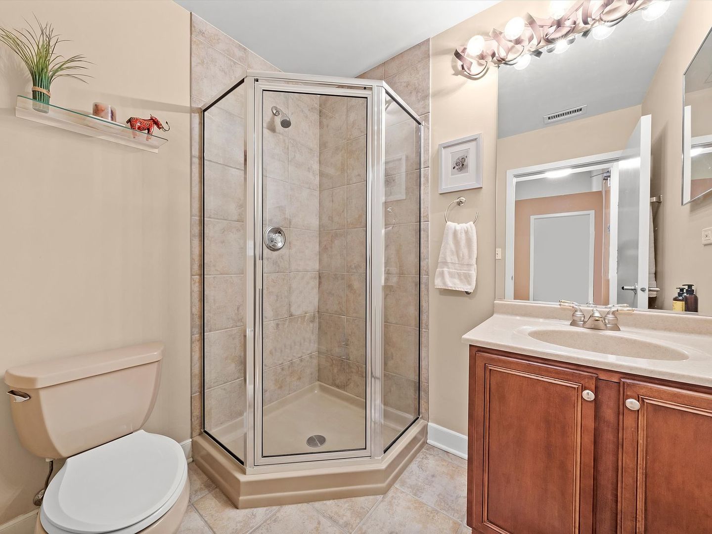 211 East Ohio Street, Unit 307 Chicago, IL 60611 - Photo 17 of 30 a bathroom with a sink a toilet and shower