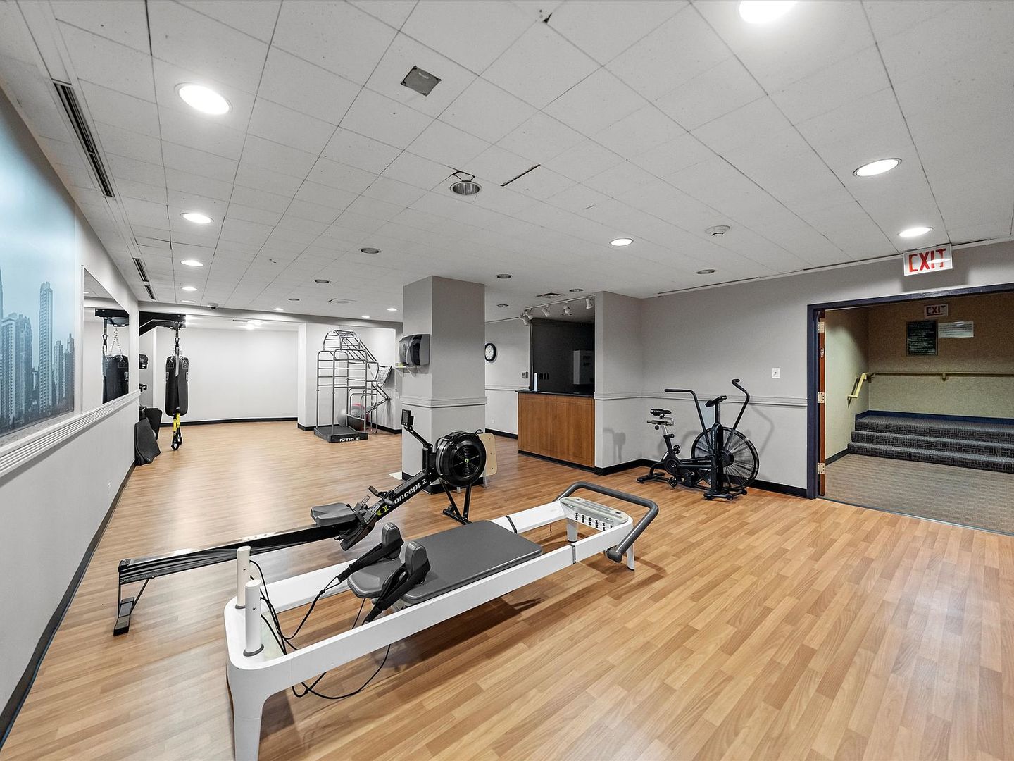 211 East Ohio Street, Unit 307 Chicago, IL 60611 - Photo 22 of 30 a room with gym equipment and a large window