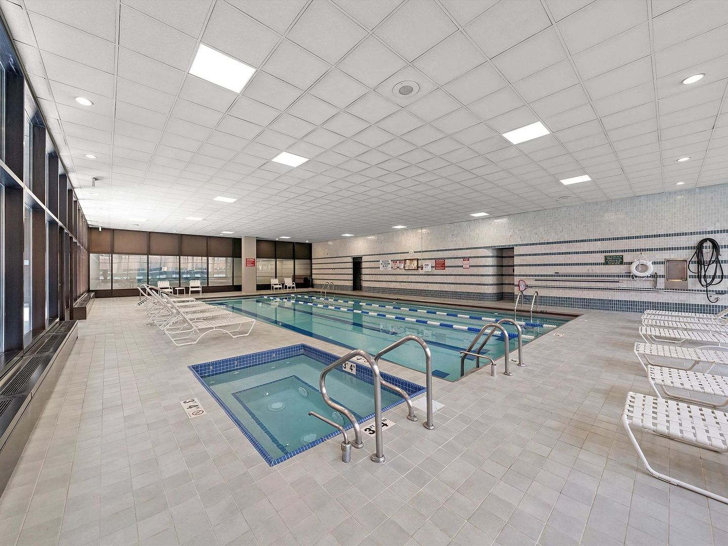 211 East Ohio Street, Unit 307 Chicago, IL 60611 - Photo 27 of 30 an empty room with wooden floor