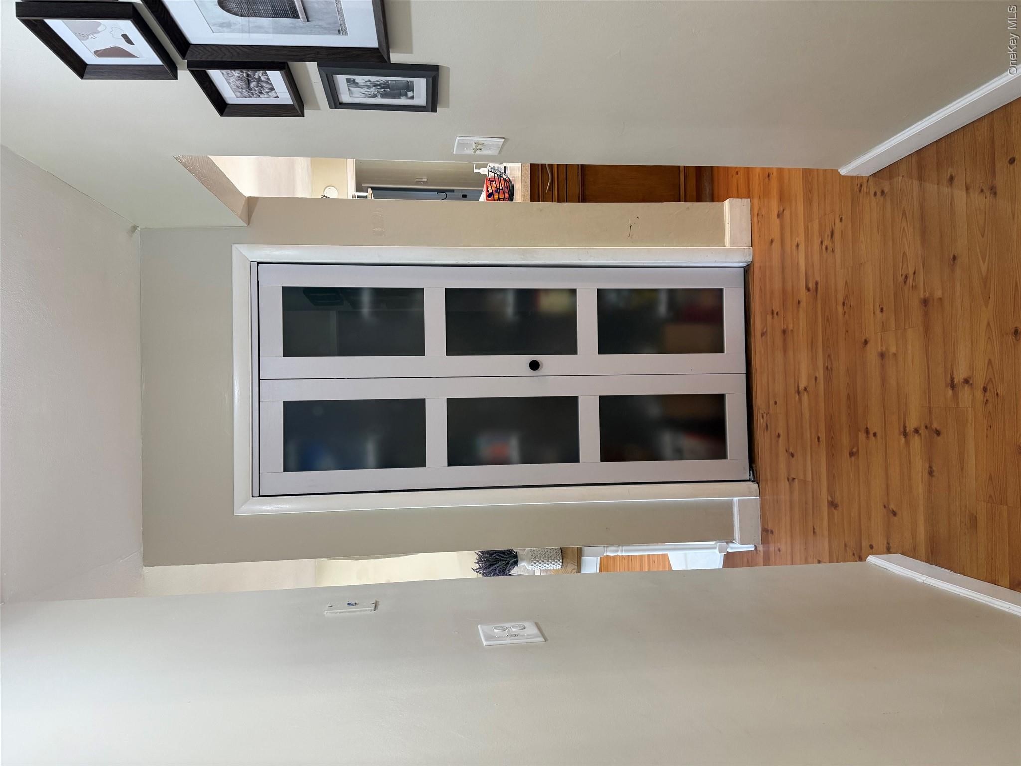 161 Hawkins Road Centereach, NY 11720 - Photo 10 of 16 a view of empty room with windows and entryway