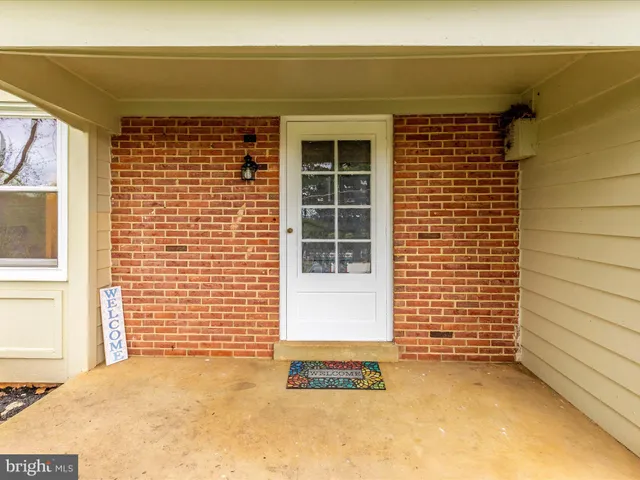 a view of a door and a window