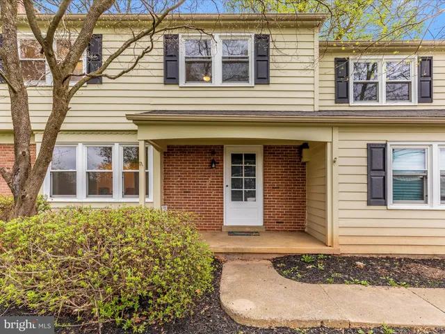 a view of a pathway with a garden