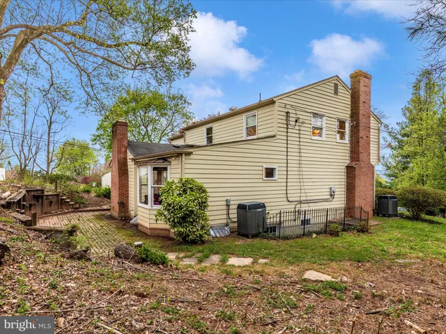 a backyard of a house with outdoor seating