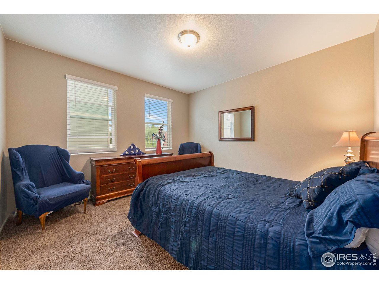 7005 Morrison Drive Frederick, CO 80530 - Photo 18 of 26 a bedroom with a bed and a couch