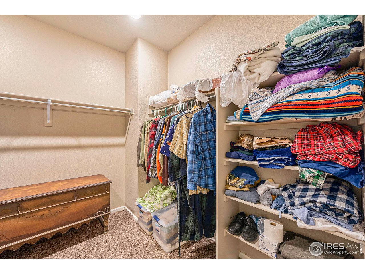 7005 Morrison Drive Frederick, CO 80530 - Photo 20 of 26 a view of walk in closet with clothes and shoes