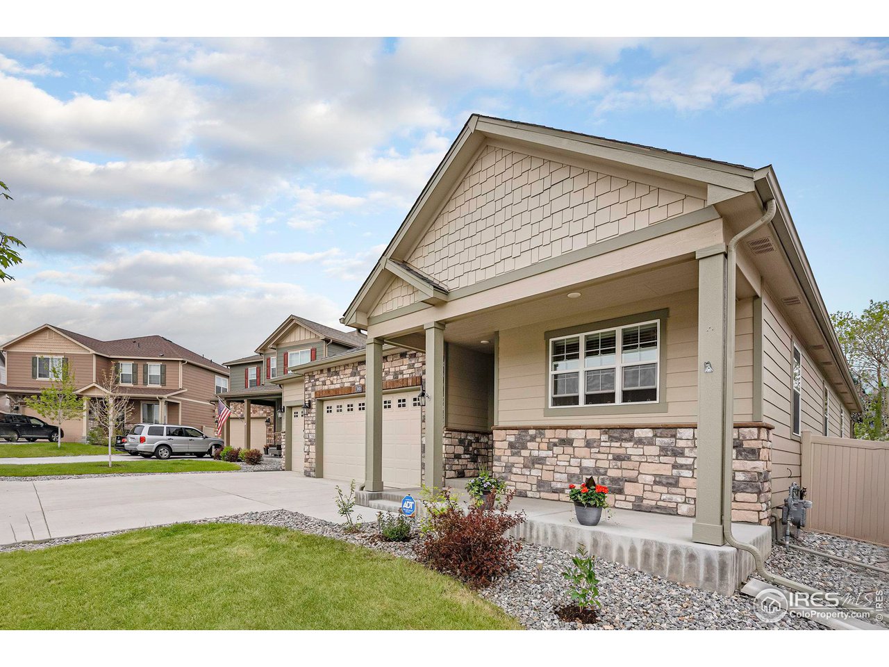 7005 Morrison Drive Frederick, CO 80530 - Photo 2 of 26 a view of a house with a garden