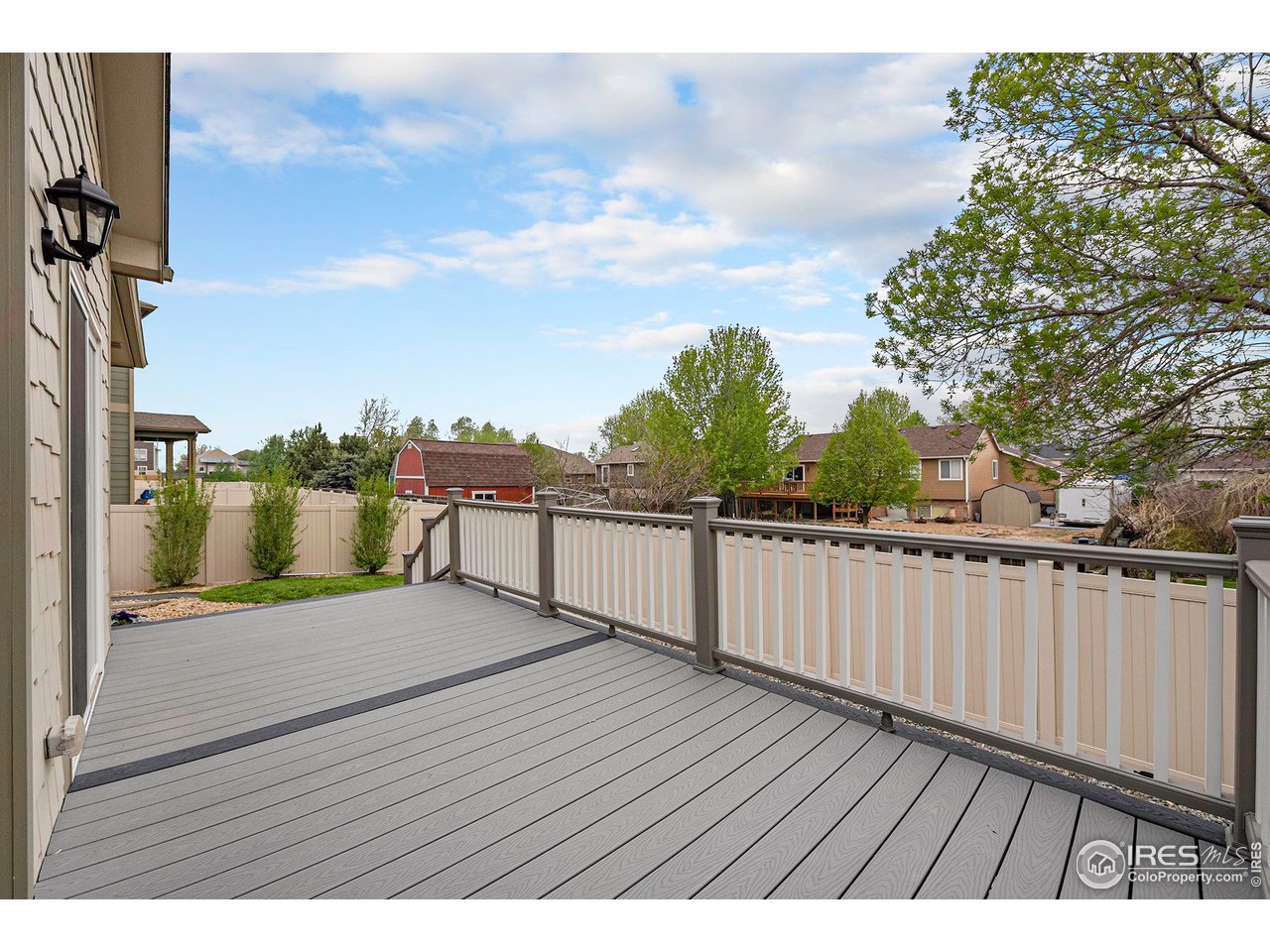 7005 Morrison Drive Frederick, CO 80530 - Photo 23 of 26 a view of a balcony with wooden floor