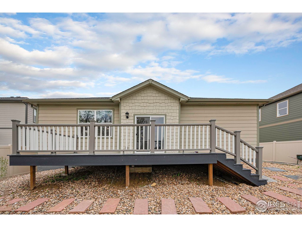 7005 Morrison Drive Frederick, CO 80530 - Photo 24 of 26 a view of a wooden deck with a bench