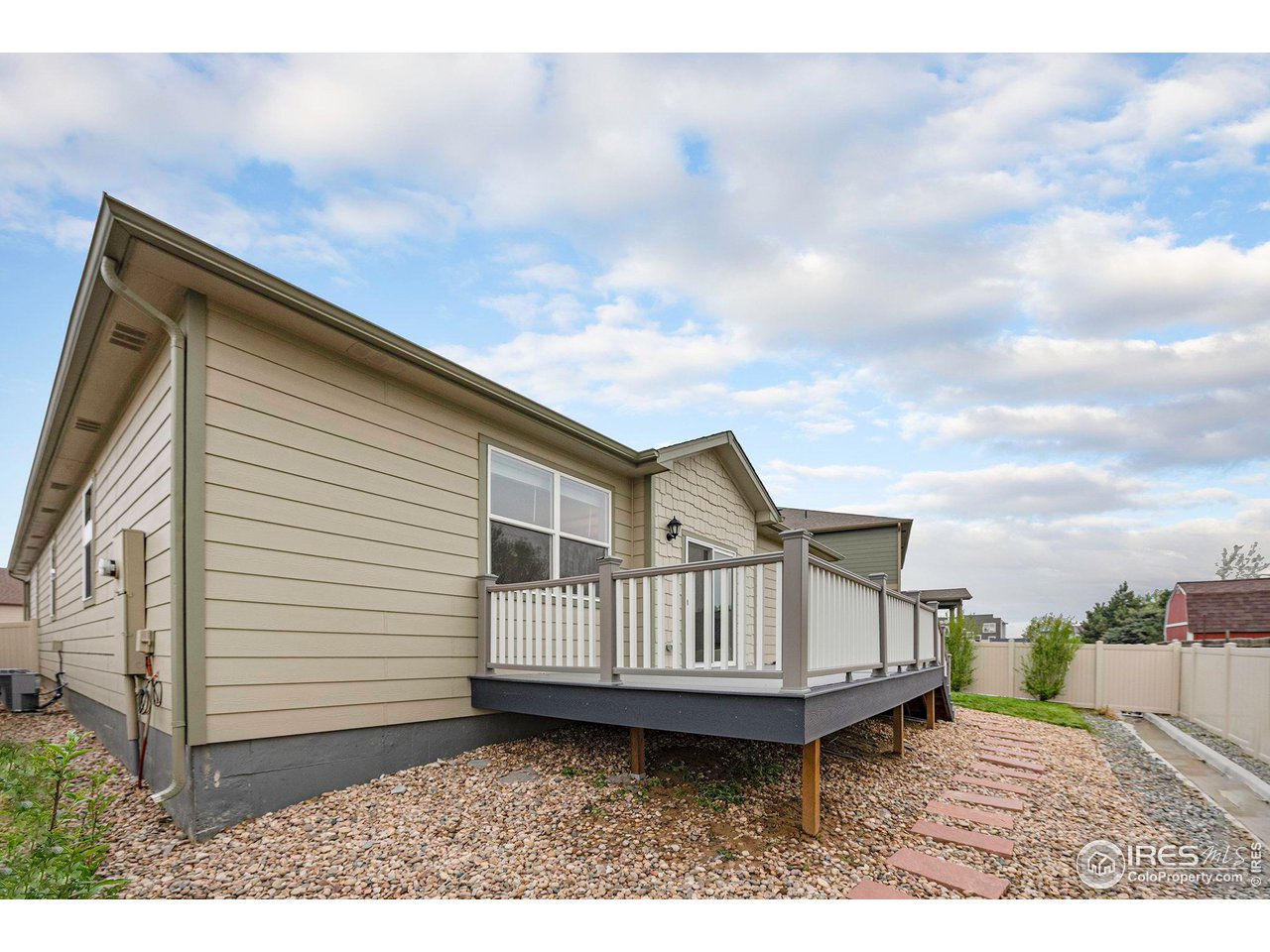 7005 Morrison Drive Frederick, CO 80530 - Photo 25 of 26 a view of a house with wooden floor roof deck