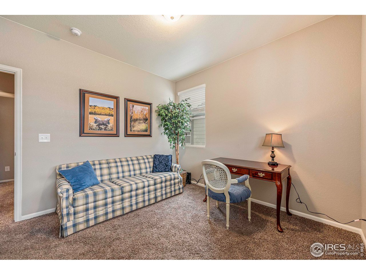 7005 Morrison Drive Frederick, CO 80530 - Photo 5 of 26 a living room with furniture and a window