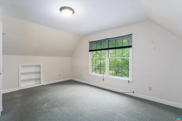 an empty room with a empty space and window