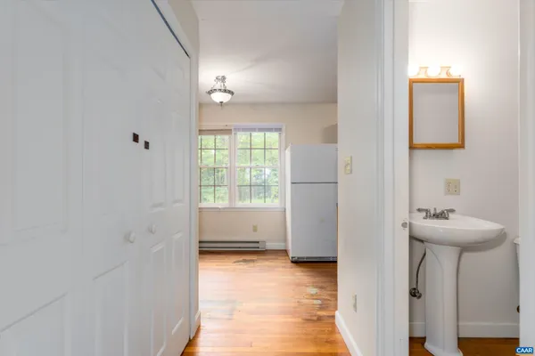 a view of bathroom with a sink and a mirror