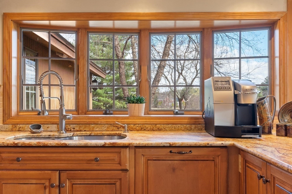 243 Concord Road Westford, MA 01886 - Photo 11 of 42 a view of a kitchen cabinets a sink and a window