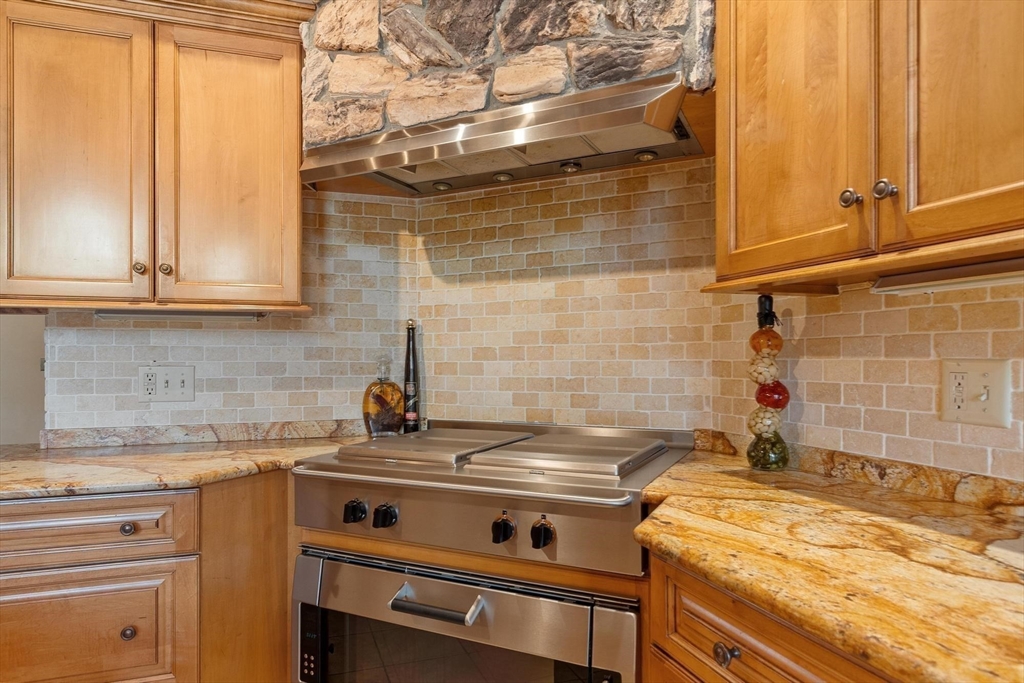 243 Concord Road Westford, MA 01886 - Photo 12 of 42 a bathroom with a granite countertop sink a mirror and shower