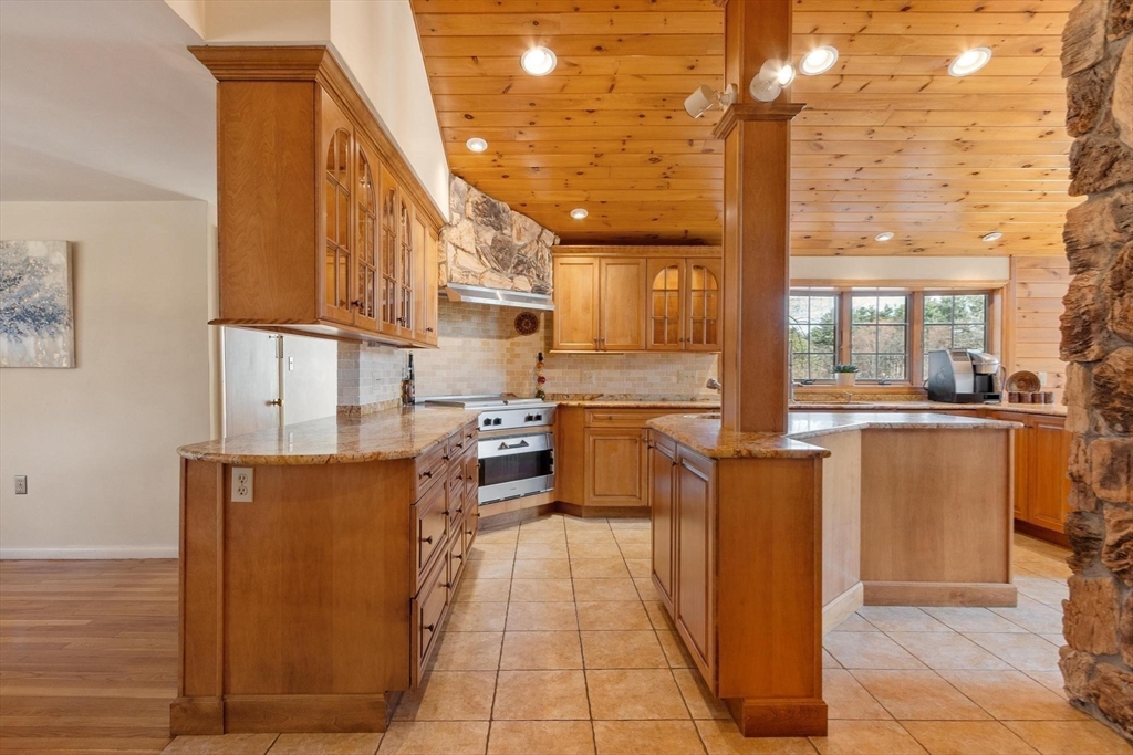 243 Concord Road Westford, MA 01886 - Photo 14 of 42 a kitchen with stainless steel appliances a refrigerator and a stove