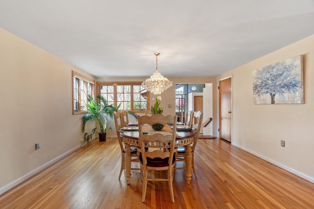 243 Concord Road Westford, MA 01886 - Photo 20 of 42 a view of a dining room with furniture window and wooden floor