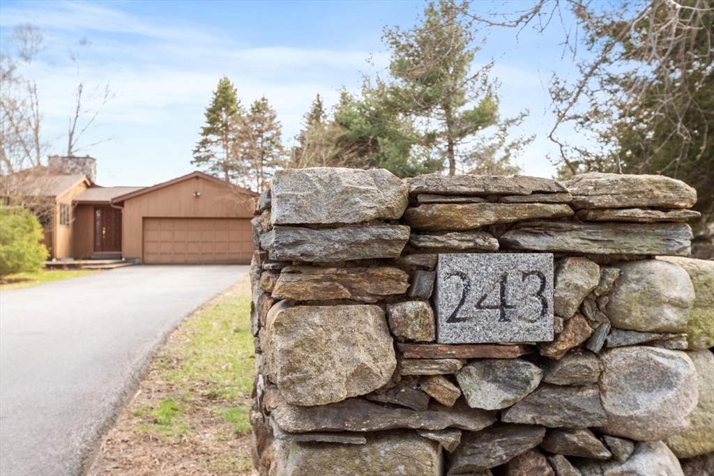 243 Concord Road Westford, MA 01886 - Photo 2 of 42 a front view of a house with garden