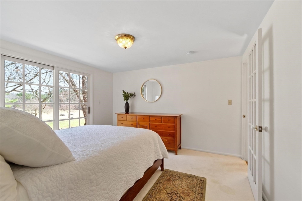 243 Concord Road Westford, MA 01886 - Photo 22 of 42 a bedroom with a bed and a window