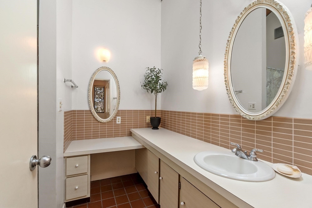 243 Concord Road Westford, MA 01886 - Photo 23 of 42 a bathroom with a sink and a mirror