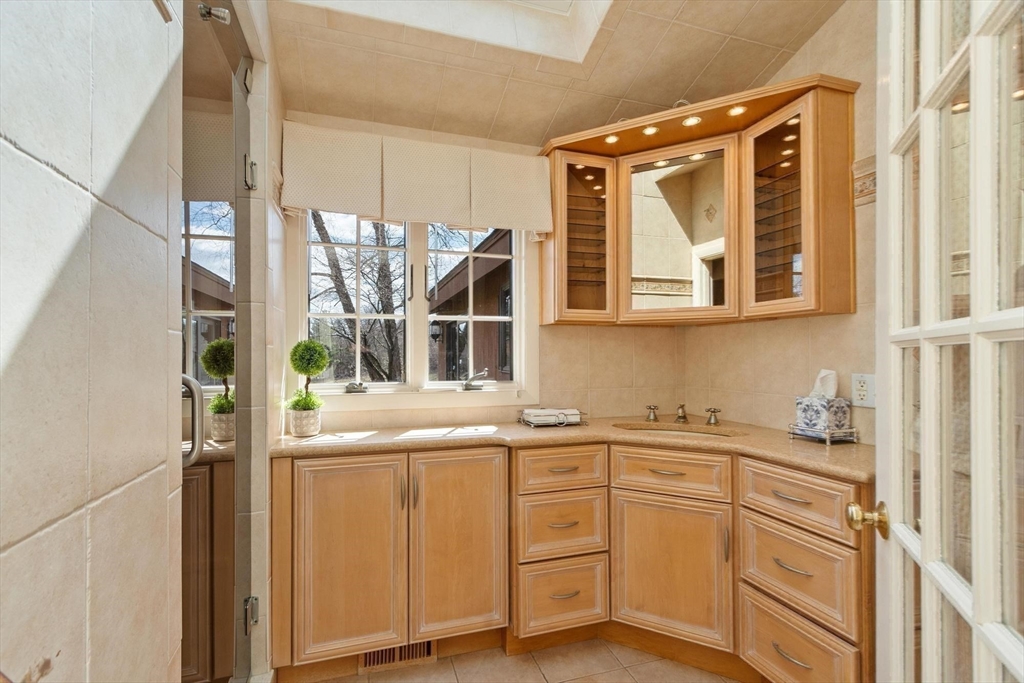 243 Concord Road Westford, MA 01886 - Photo 29 of 42 a kitchen with a sink and cabinets
