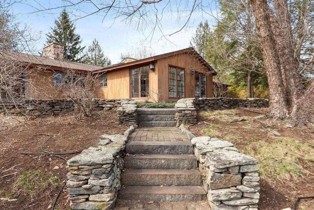 243 Concord Road Westford, MA 01886 - Photo 35 of 42 a front view of a house with garden