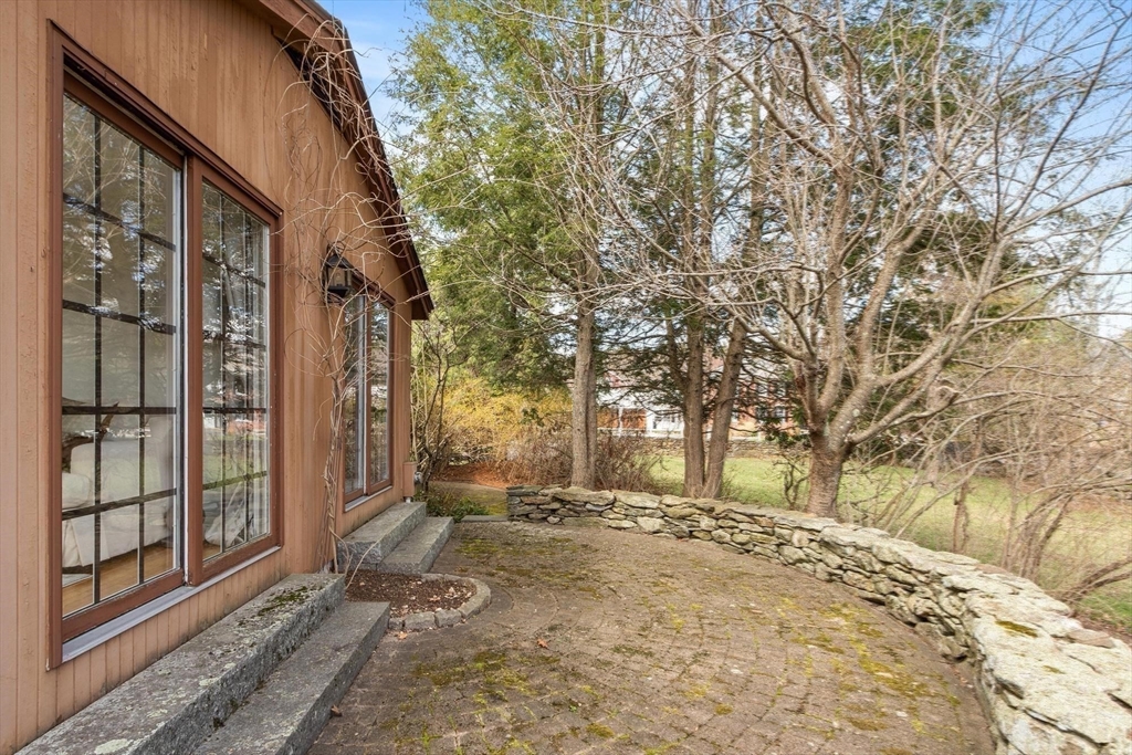 243 Concord Road Westford, MA 01886 - Photo 37 of 42 a view of a yard with snow on the road