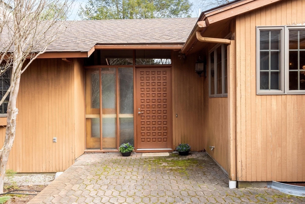 243 Concord Road Westford, MA 01886 - Photo 5 of 42 a view of entrance of the house